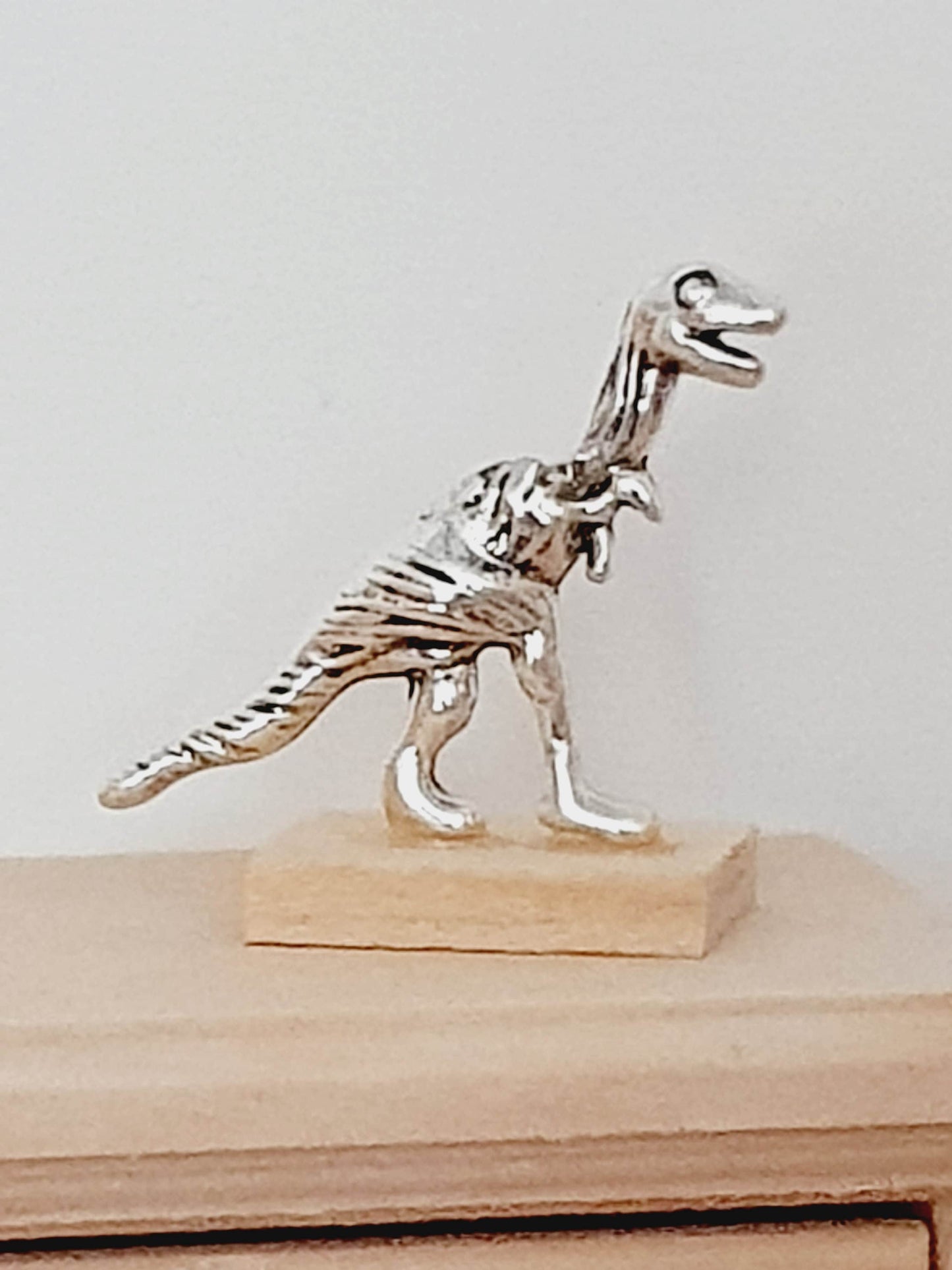 Dolls House Small Dinosaur Ornament on a wooden stand, 1:12th Scale, Miniature dino on a stand