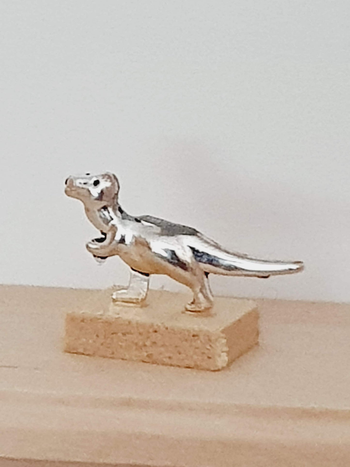 Dolls House Small Dinosaur Ornament on a wooden stand, 1:12th Scale, Miniature dino on a stand