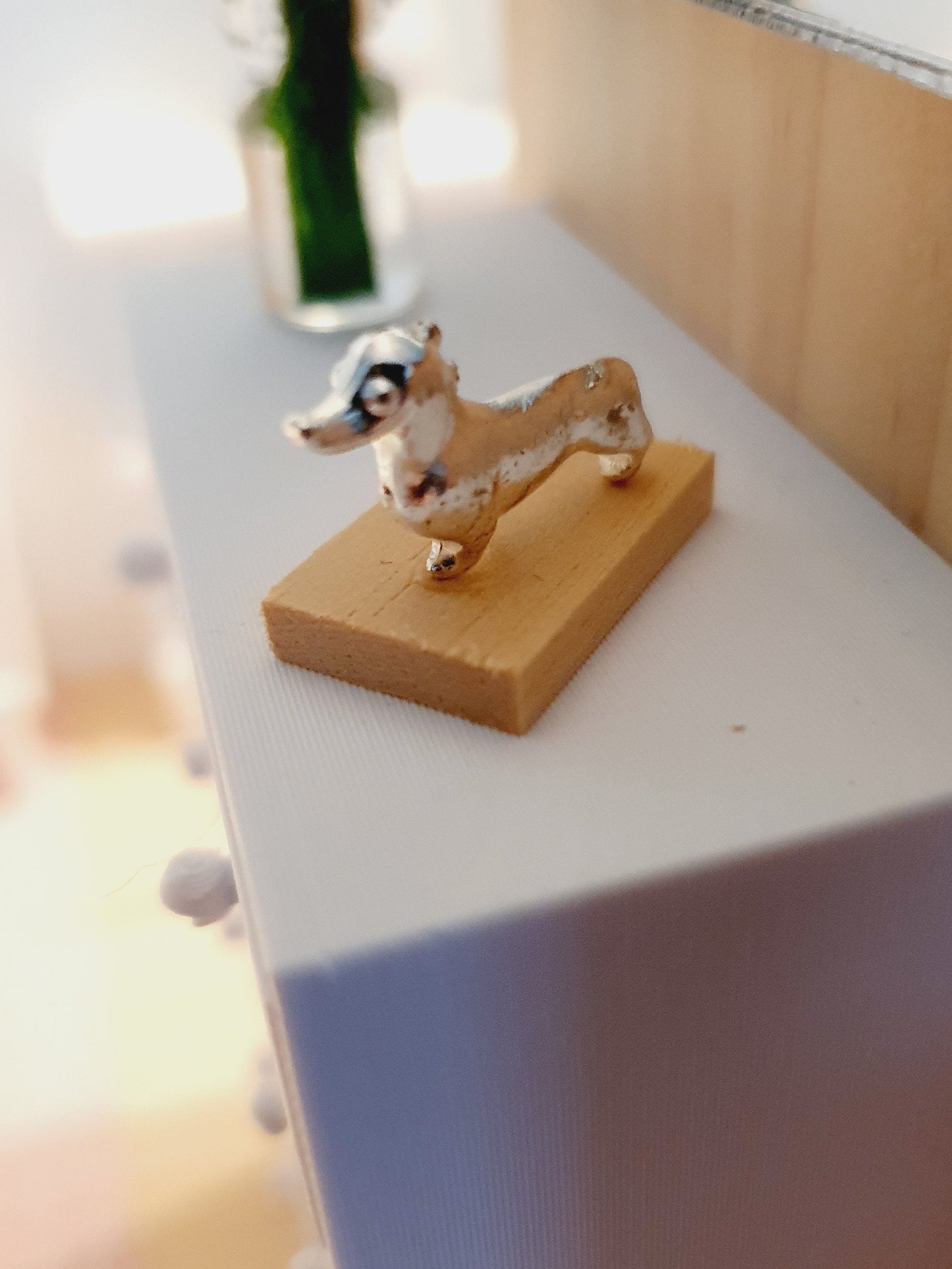 Dolls House Small Sausage Dog Ornament on a wooden stand, 1:12th Scale, Miniature dog on a stand