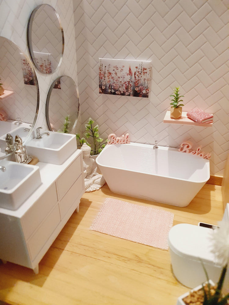 Dolls House bath, vanity and toilet set up in a bathroom 