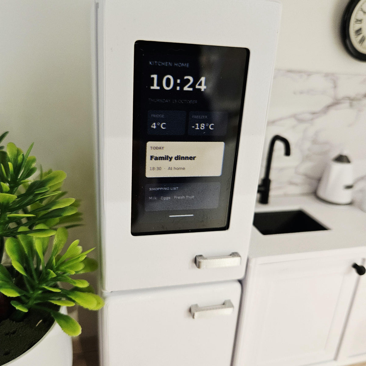 White dolls house fridge door with a printed screen insert and silver handle