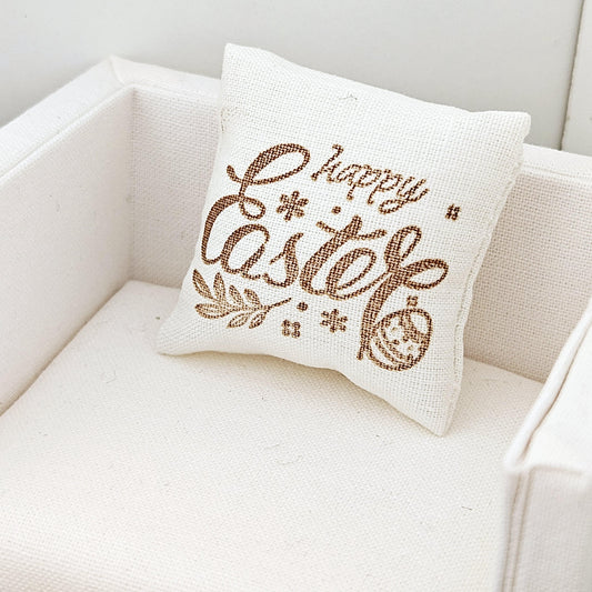 dollhouse cushion, 3cm, cream with gold writing with happy easter, cushion has an easter egg on it, 12th scale, miniature cushion
