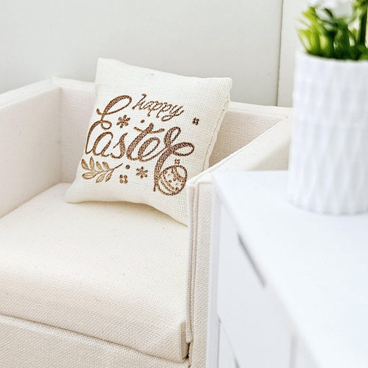 dollhouse cushion, 3cm, cream with gold writing with happy easter, cushion has an easter egg on it, 12th scale, miniature cushion