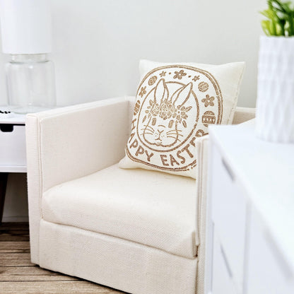 dollhouse cushion, 4cm, cream with gold writing with happy easter and a bunny face in a circle on a square cushion, 12th scale, miniature cushion