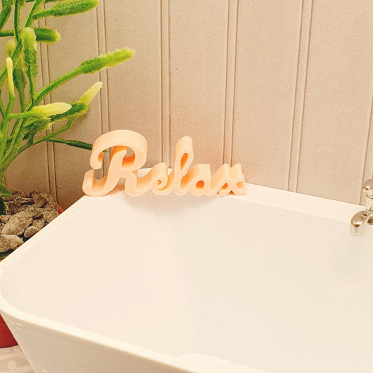 dollhouse bath sign, word relax, pink,  H: 1.4 cm W: 3.8cm D: 0.7 cm,3d printed, 12thscale miniature