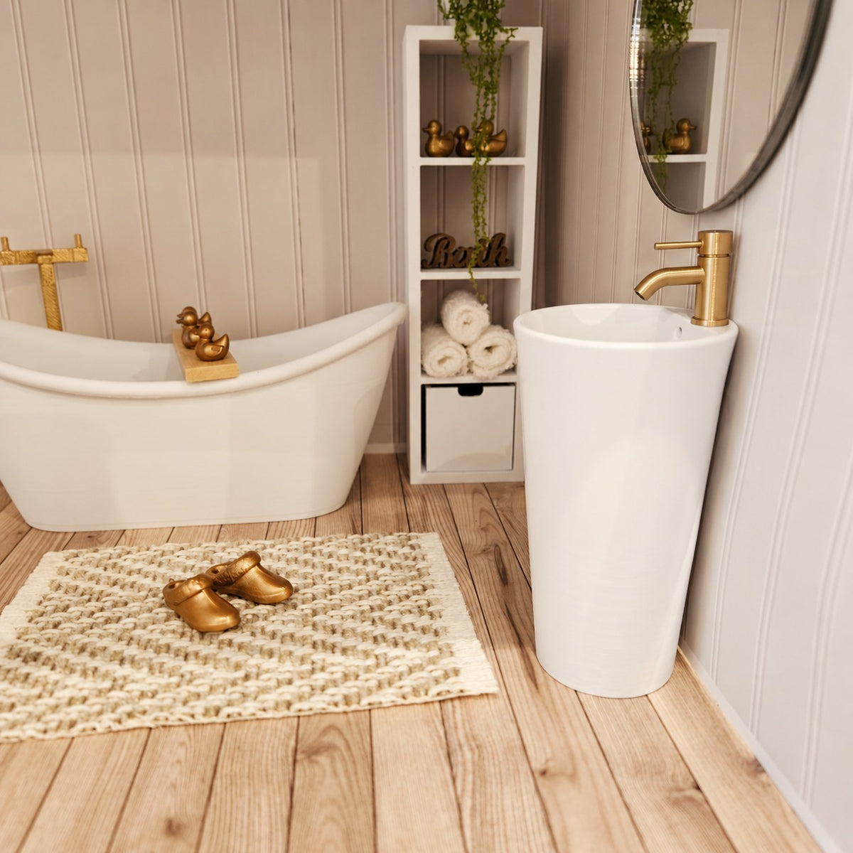 Modern white 1:12 scale dolls house bathroom sink with gold tap in a miniature bathroom