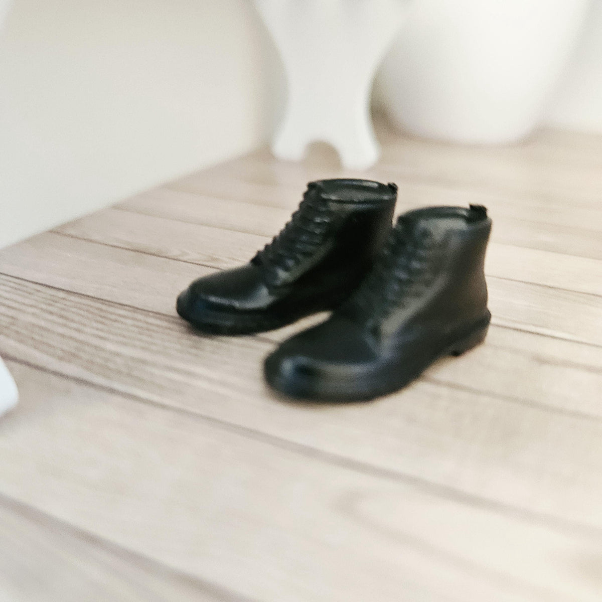 Black dm style boots – one pair in a 1:12 scale dolls house display