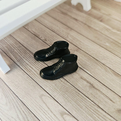 Black dm style boots – one pair in a 1:12 scale dolls house display, detail view
