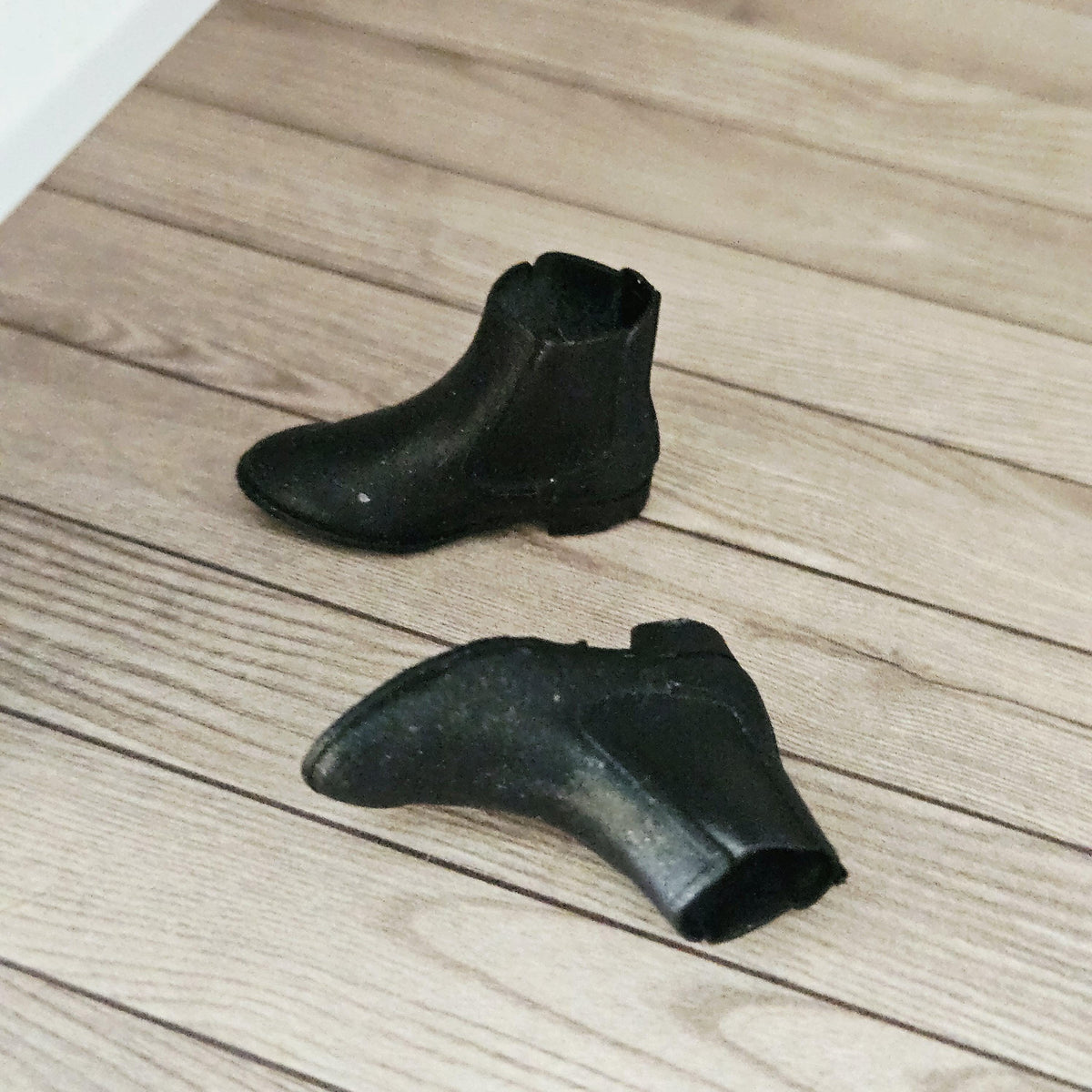 Black chelsea boots – one pair in a 1:12 scale dolls house display