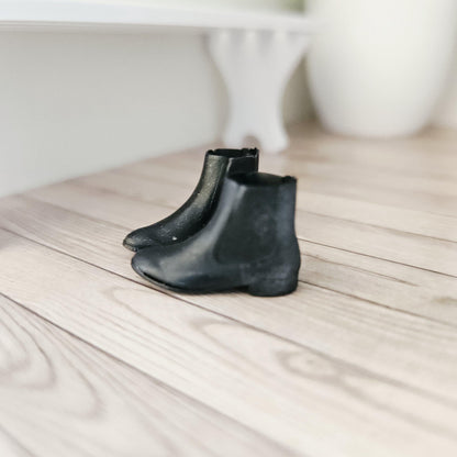 Black chelsea boots – one pair in a 1:12 scale dolls house display, detail view