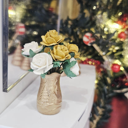 Gold Christmas scene vase with gold and white roses on a dolls house sideboard, 1:12 scale