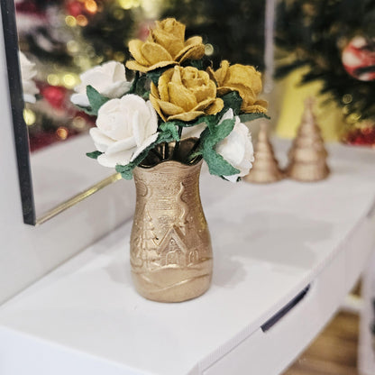Gold Christmas scene vase with gold and white roses on a dolls house sideboard, 1:12 scale