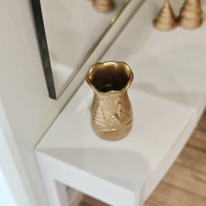 Gold flared christmas scene vase in a 1:12 scale dolls house display, detail view