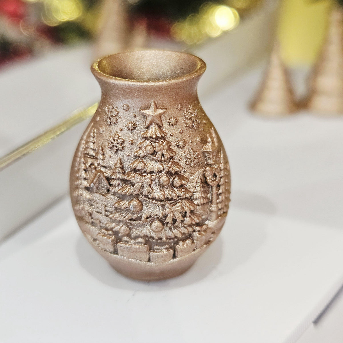 Copper christmas tree vase in a 1:12 scale dolls house display, detail view