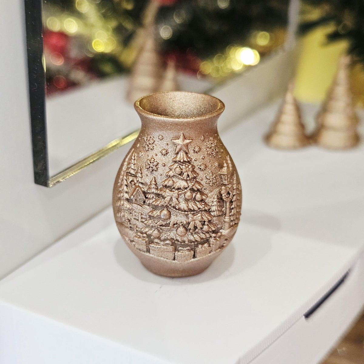 Copper christmas tree vase in a 1:12 scale dolls house display, detail view