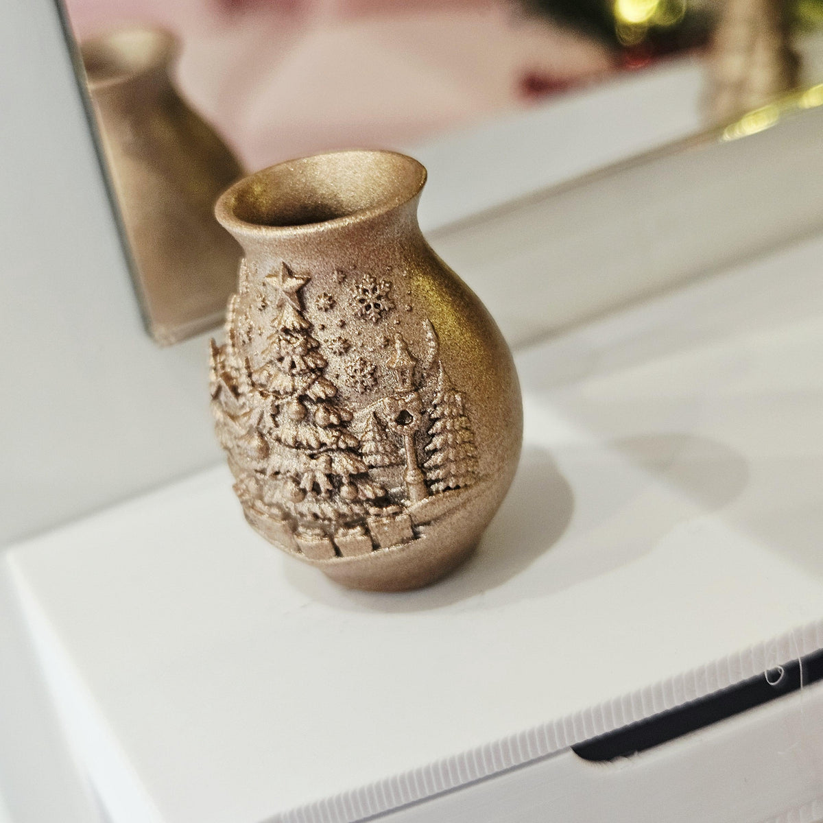 Copper christmas tree vase in a 1:12 scale dolls house display, detail view