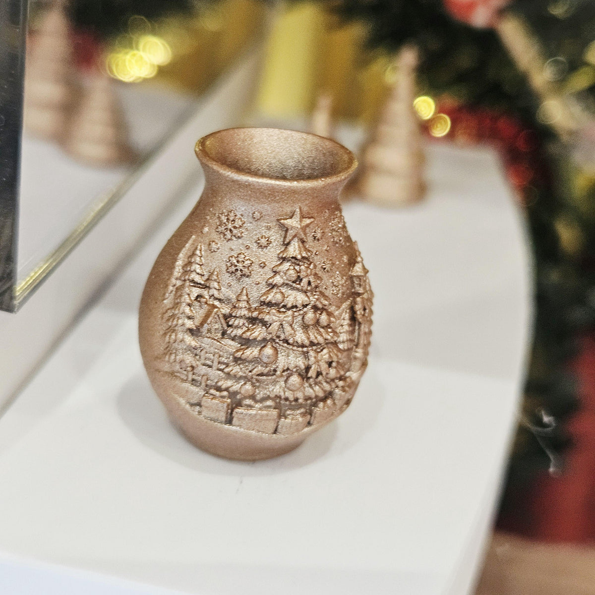 Copper christmas tree vase in a 1:12 scale dolls house display, detail view