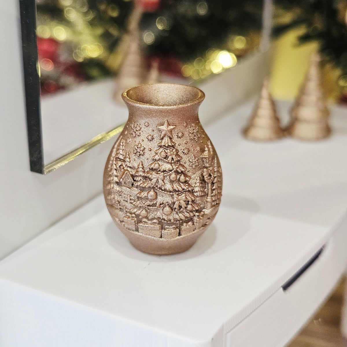 Copper christmas tree vase in a 1:12 scale dolls house display, detail view