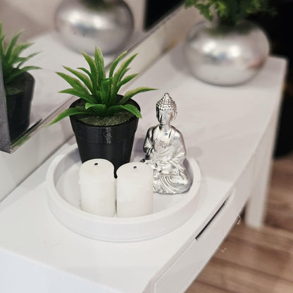 Silver Buddha, two white candles and a green plant in a black pot on a white tray, 1:12 scale dolls house