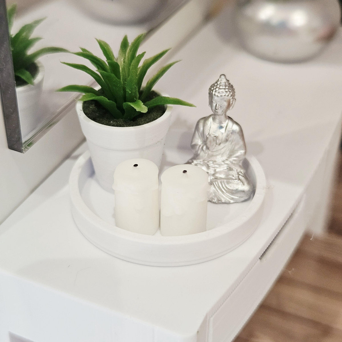 Silver Buddha, two white candles and a green plant in a white pot on a white tray, 1:12 scale dolls house