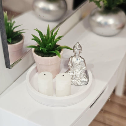 Silver Buddha, two white candles and a green plant in a pink pot on a white tray, 1:12 scale dolls house