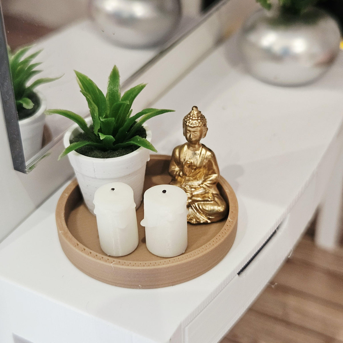 Gold Buddha, two white candles and a green plant in a white pot on a wood effect tray, 1:12 scale dolls house