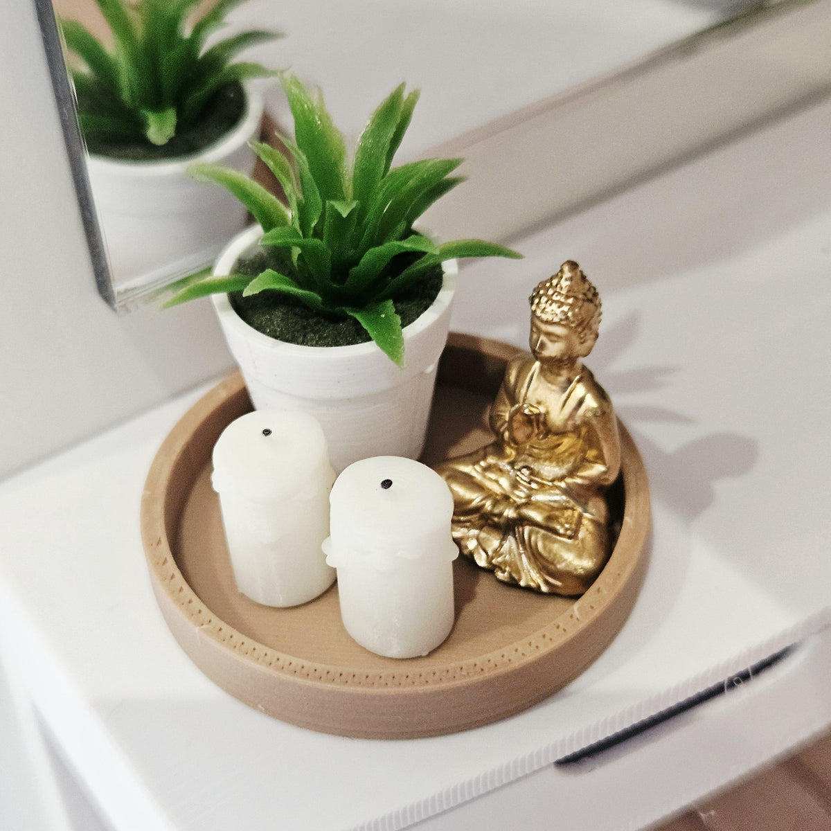 Gold Buddha, two white candles and a green plant in a white pot on a wood effect tray, 1:12 scale dolls house