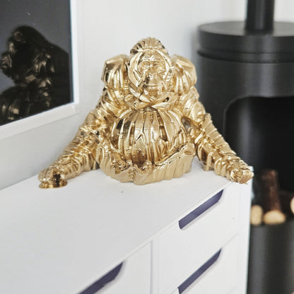 Gold shelf orangutan ornament in a 1:12 scale dolls house display, detail view