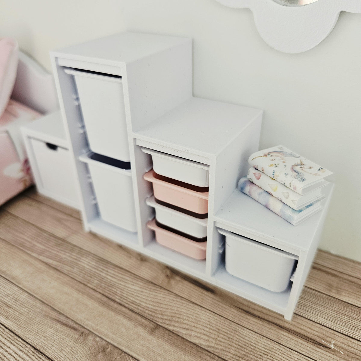 Pink & White storage unit with seven trays & bins in a 1:12 scale dolls house display, detail view