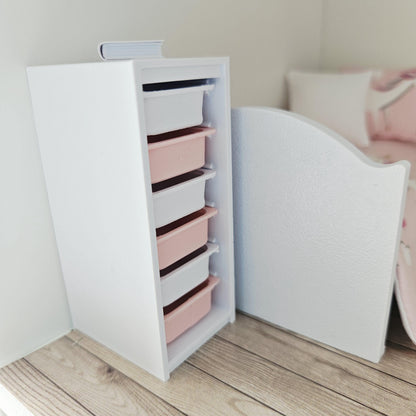 Pink & White storage unit with six boxes in a 1:12 scale dolls house display