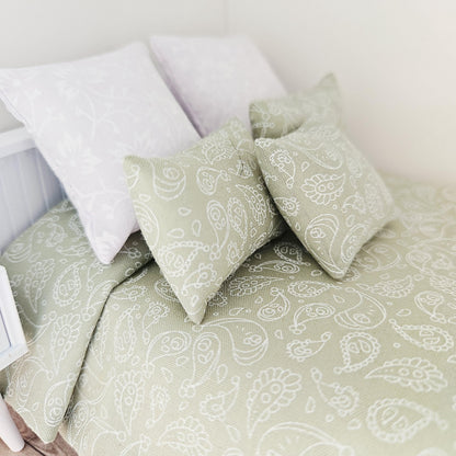 green paisley double bedding set in a 1:12 scale dolls house display, detail view 3