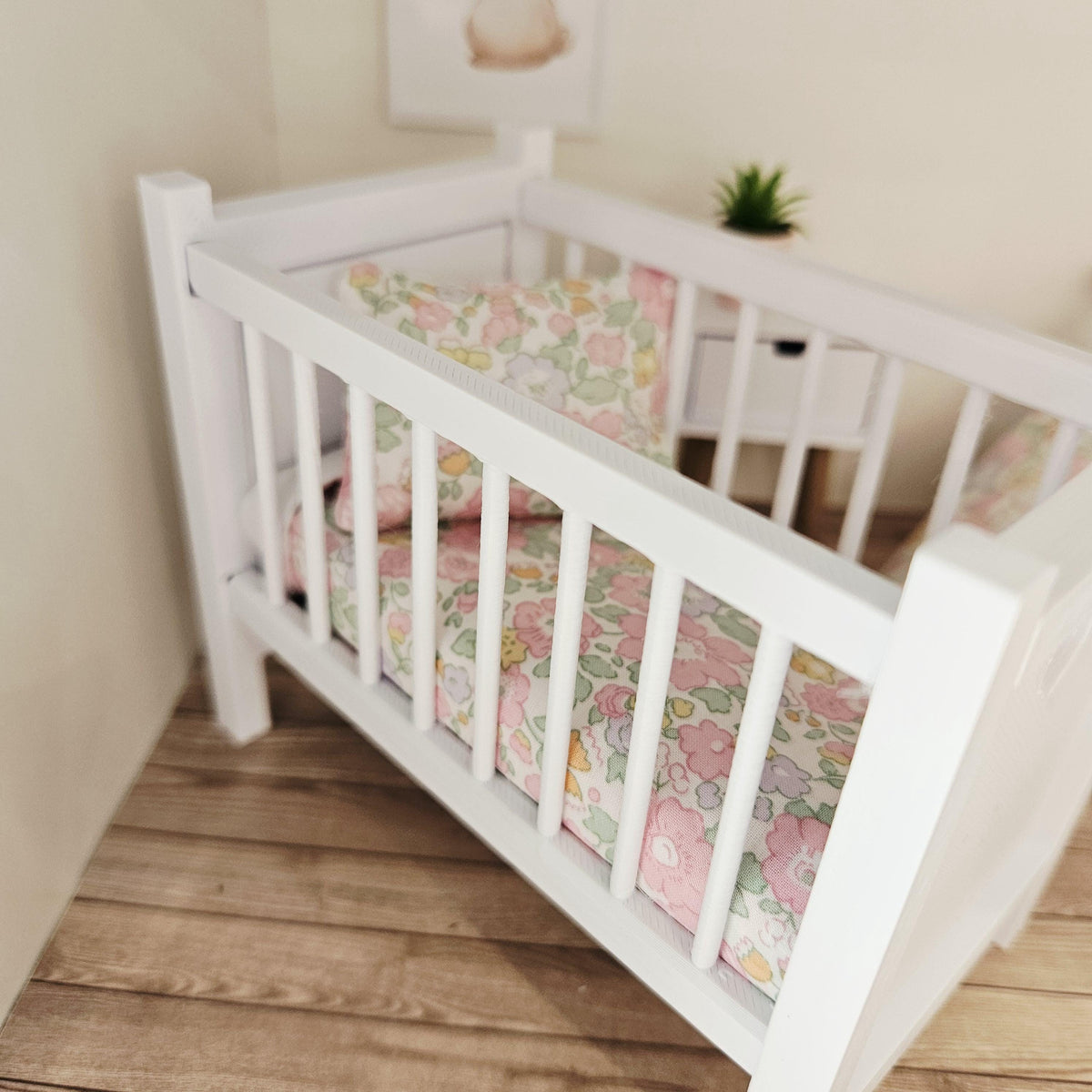 pastel liberty floral cot bedding set in a 1:12 scale dolls house display, detail view 2