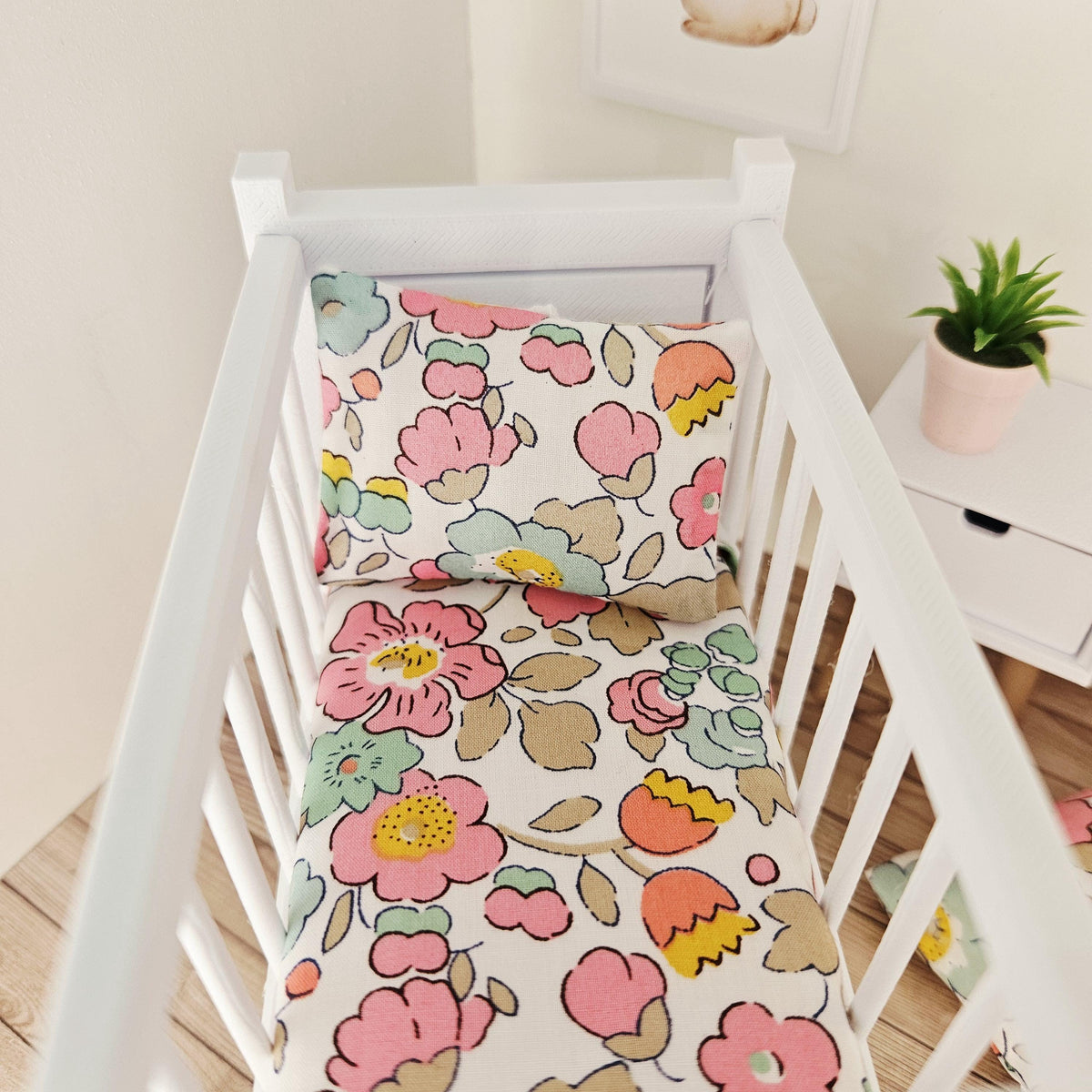 pink & yellow liberty floral cot bedding set in a 1:12 scale dolls house display, detail view 4