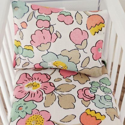 pink & yellow liberty floral cot bedding set in a 1:12 scale dolls house display, detail view 5