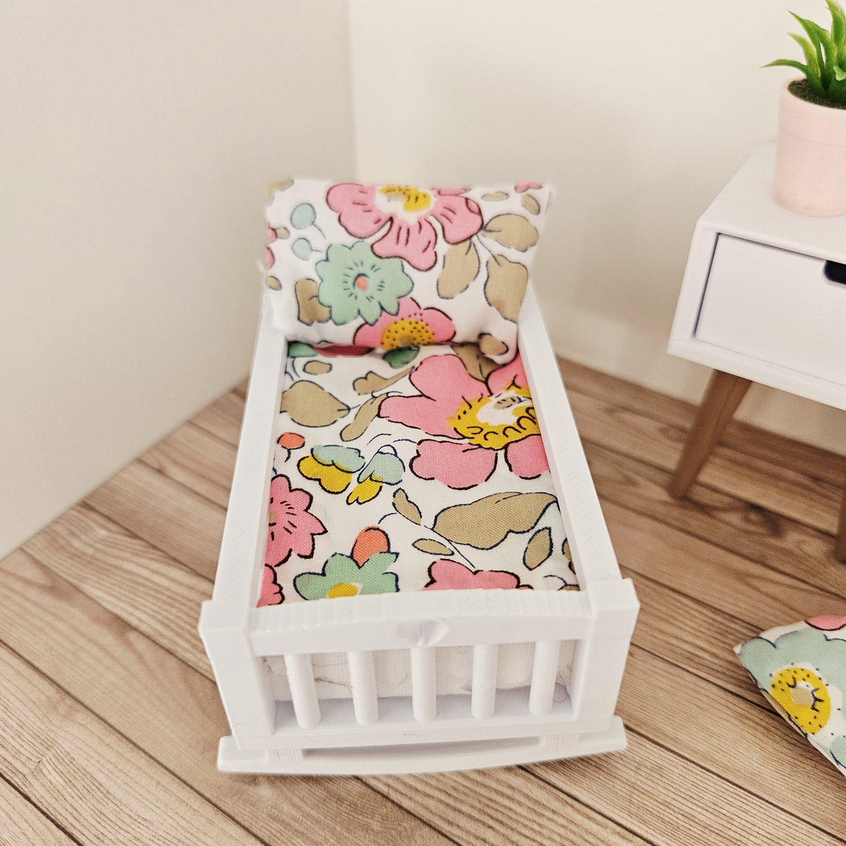 pink & yellow liberty floral crib bedding set in a 1:12 scale dolls house display