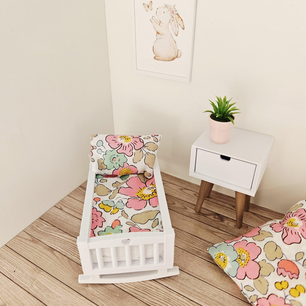 pink & yellow liberty floral crib bedding set in a 1:12 scale dolls house display, detail view 2