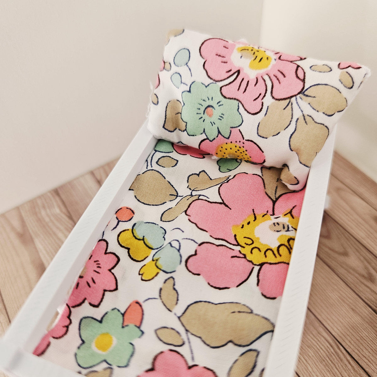 pink & yellow liberty floral crib bedding set in a 1:12 scale dolls house display, detail view 4