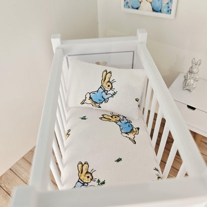 peter rabbit cot bedding set in a 1:12 scale dolls house display