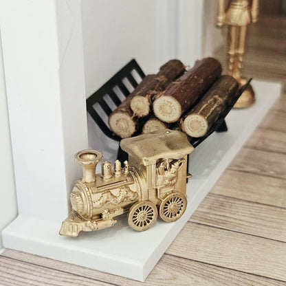 Gold christmas santa train ornament in a 1:12 scale dolls house display