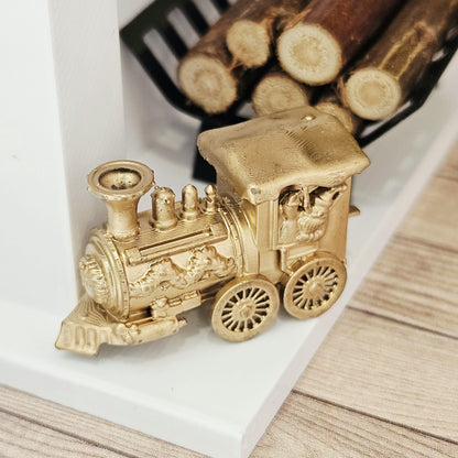 Gold christmas santa train ornament in a 1:12 scale dolls house display, detail view 2