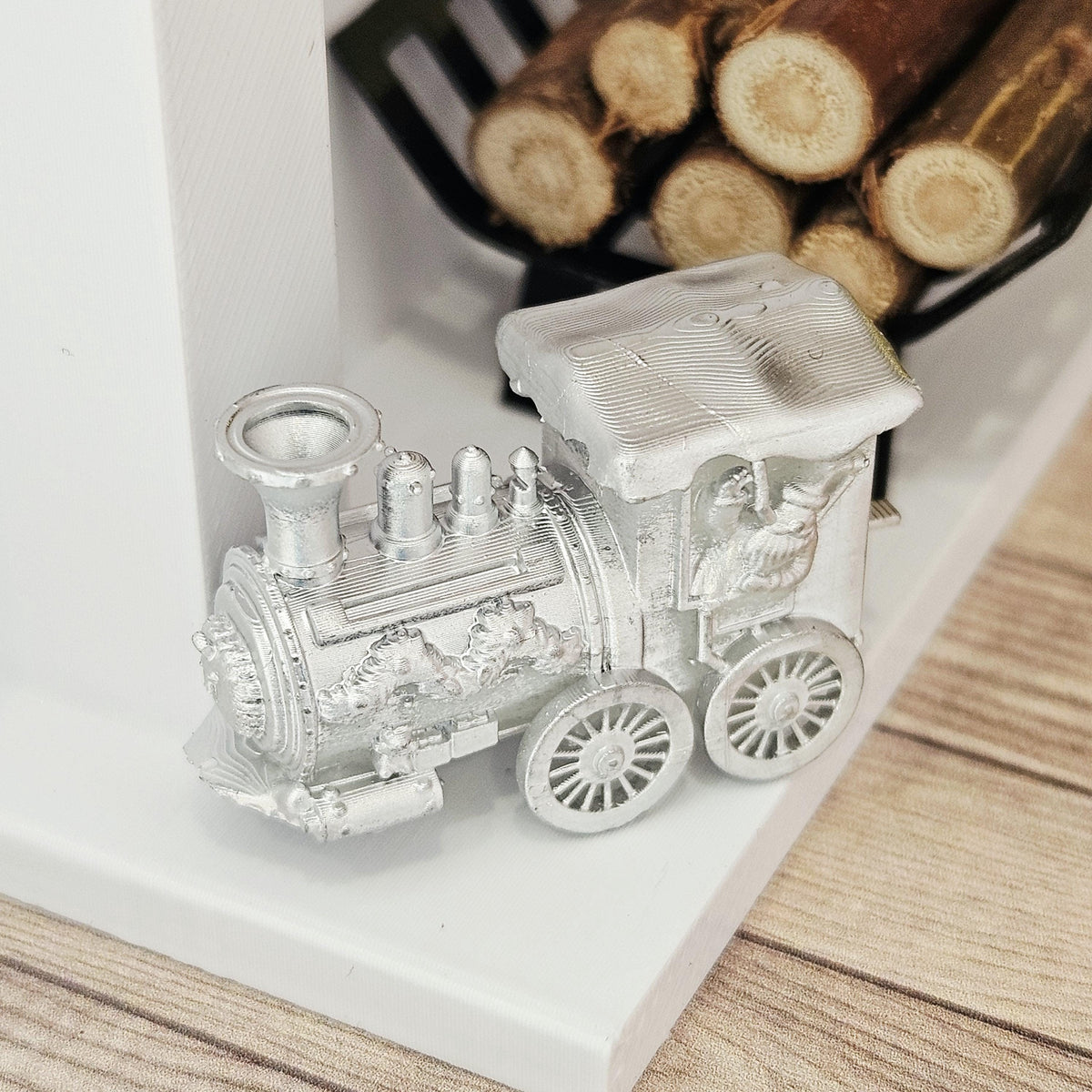 Silver christmas santa train ornament in a 1:12 scale dolls house display, detail view 3