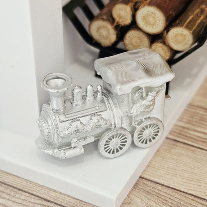 Silver christmas santa train ornament in a 1:12 scale dolls house display, detail view 3