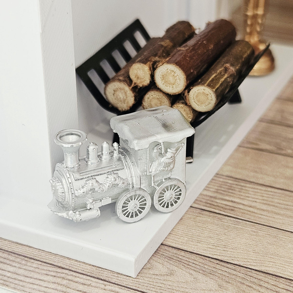 Silver christmas santa train ornament in a 1:12 scale dolls house display, detail view 4