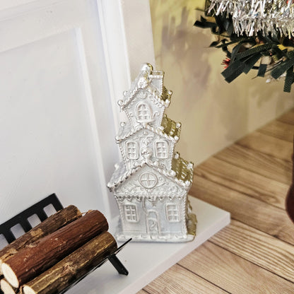 Silver tall christmas gingerbread house in a 1:12 scale dolls house display