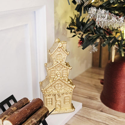 Gold tall christmas gingerbread house in a 1:12 scale dolls house display, detail view 2