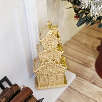 Gold tall christmas gingerbread house in a 1:12 scale dolls house display, detail view 3