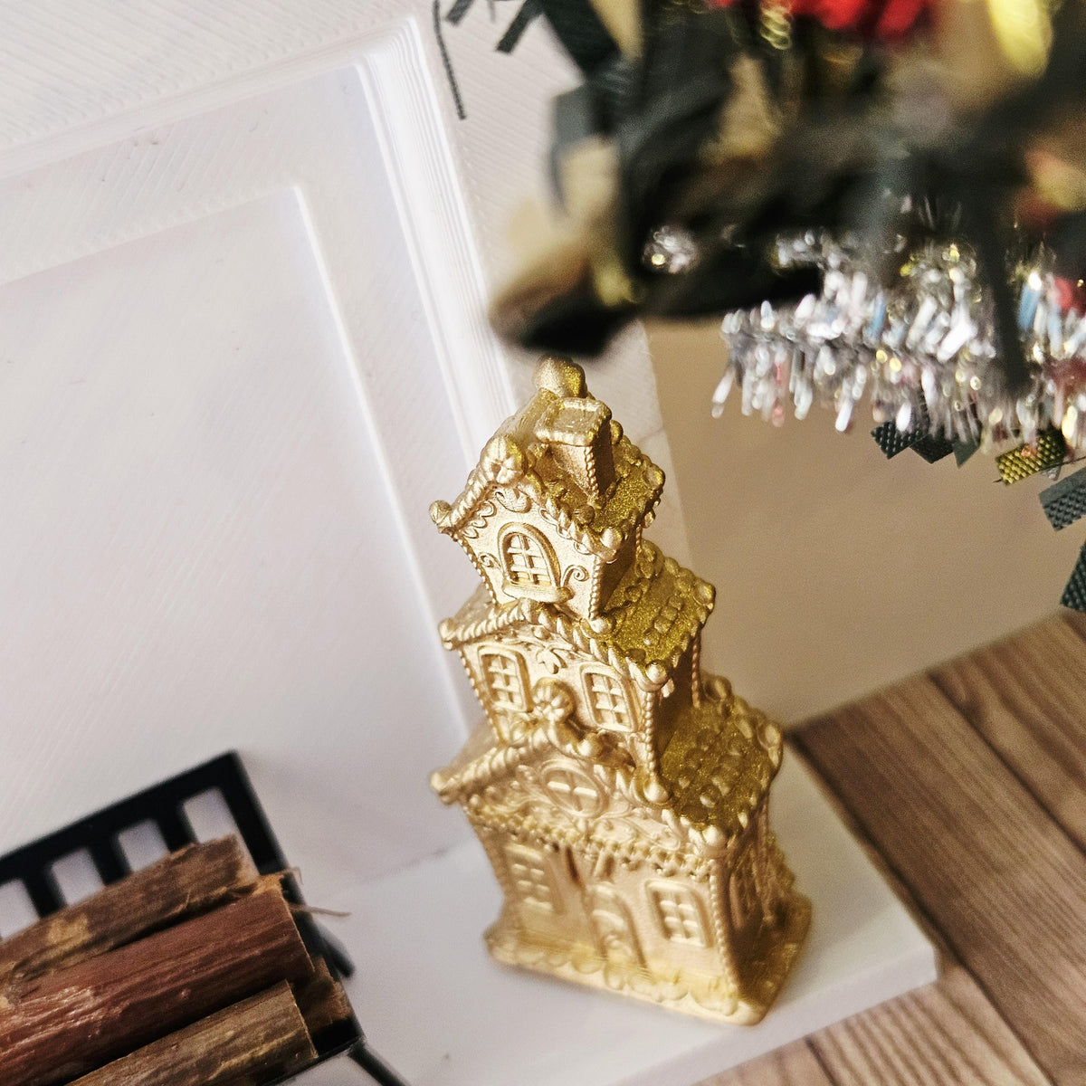 Gold tall christmas gingerbread house in a 1:12 scale dolls house display, detail view 4