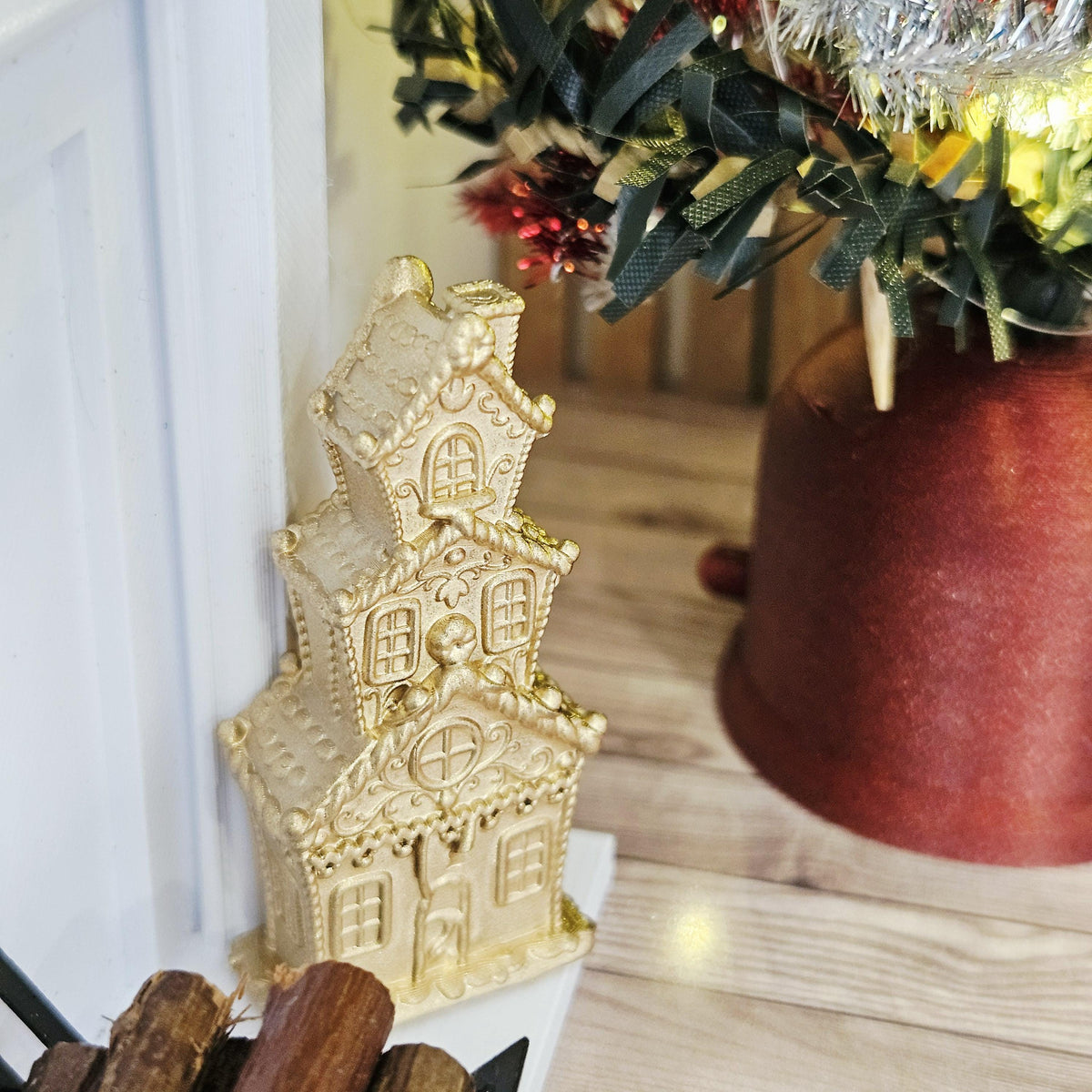 Gold tall christmas gingerbread house in a 1:12 scale dolls house display, detail view 5