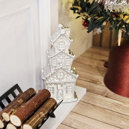 Silver tall christmas gingerbread house in a 1:12 scale dolls house display, detail view 6