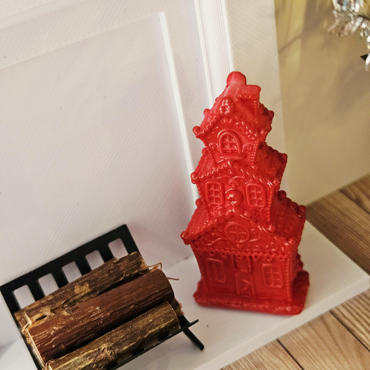 Red tall christmas gingerbread house in a 1:12 scale dolls house display, detail view 8